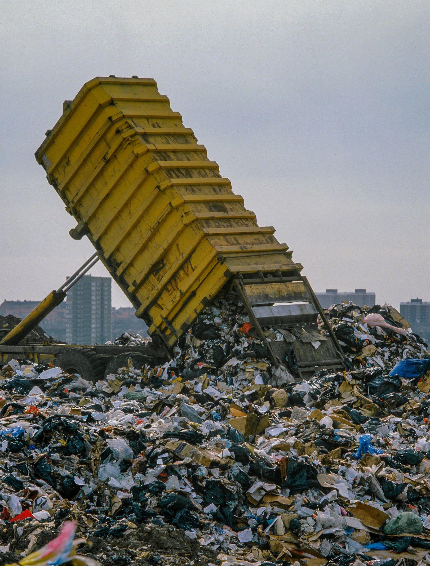 Truck unloading waste onto landfill site